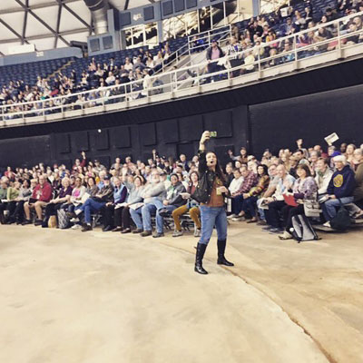 Shawna Coronado speaking at a stadium